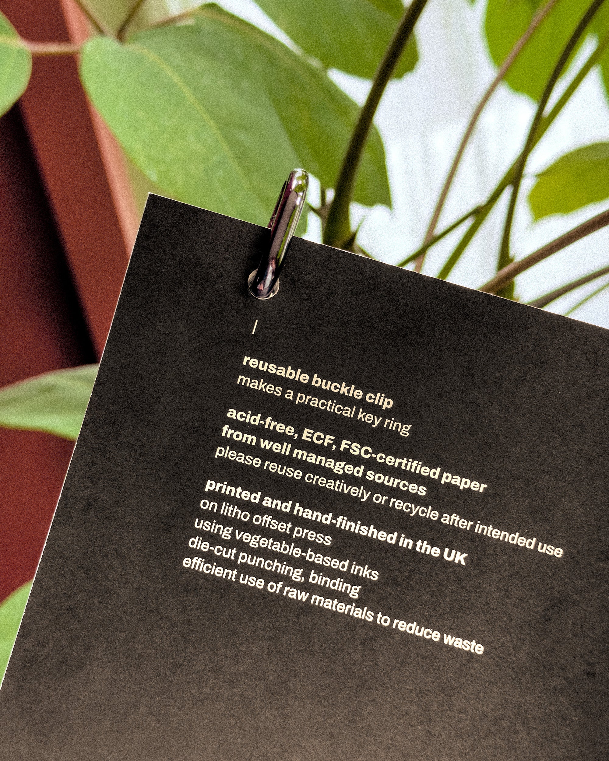 Black label with text on a plant background